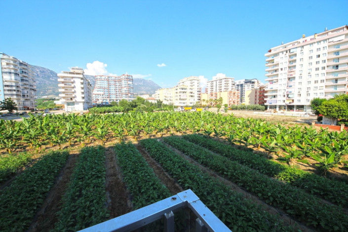 В центре района Махмутлар двухкомнатная квартира с современным ремонтом, 65 м2 - Ракурс 9