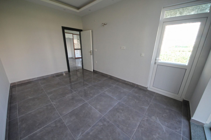 В центре района Махмутлар двухкомнатная квартира с современным ремонтом, 65 м2 - Ракурс 11