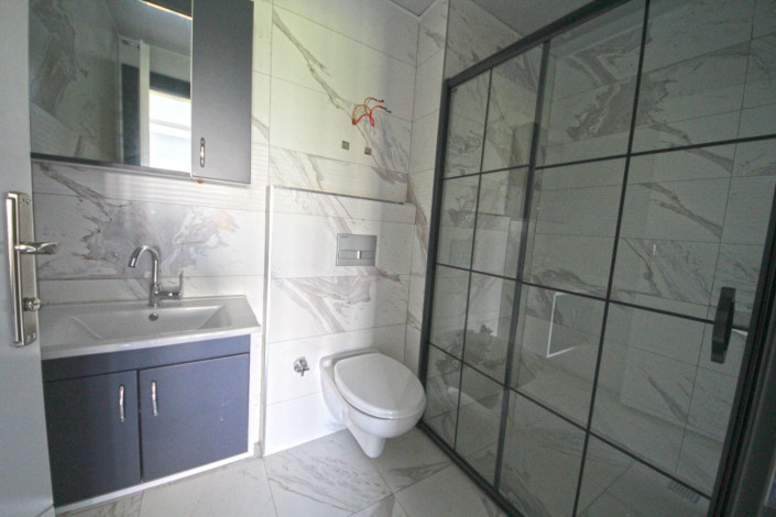 В центре района Махмутлар двухкомнатная квартира с современным ремонтом, 65 м2 - Ракурс 13