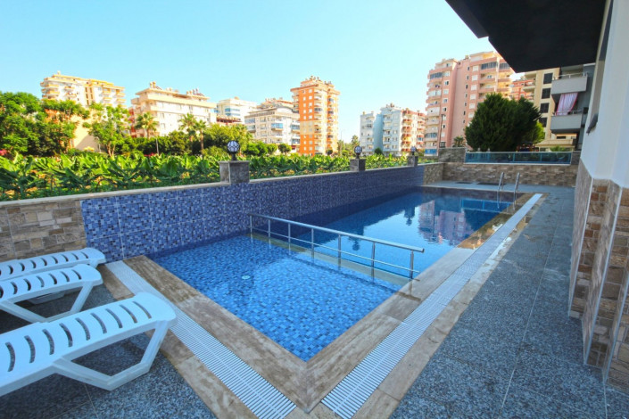 В центре района Махмутлар двухкомнатная квартира с современным ремонтом, 65 м2 - Ракурс 17