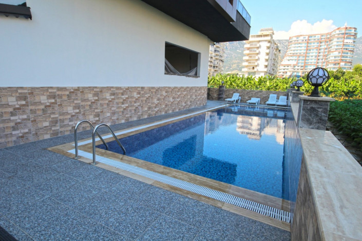 В центре района Махмутлар двухкомнатная квартира с современным ремонтом, 65 м2 - Ракурс 21