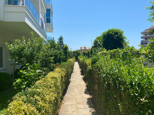 Меблированные апартаменты 1+1 с видом на море в районе Тосмур, 65 м2 - Ракурс 19