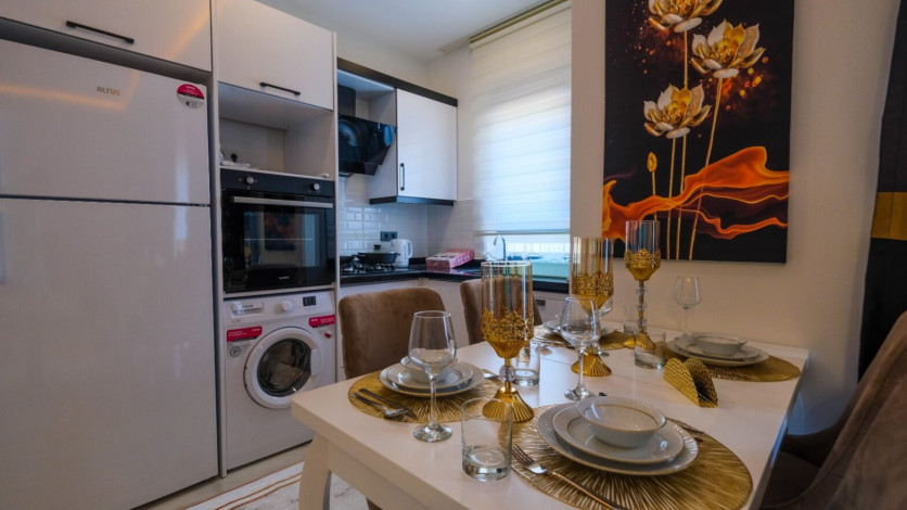 Меблированная квартира планировки 1+1, 60м2 в новом жилом комплексе, район Махмутлар - Ракурс 10