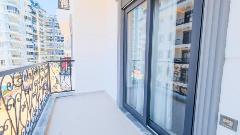 Меблированная квартира планировки 1+1, 60м2 в новом жилом комплексе, район Махмутлар - Ракурс 17