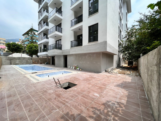 Апартаменты 1+1, 49м2 в новом жилом комплексе в центре города Аланья - Ракурс 18