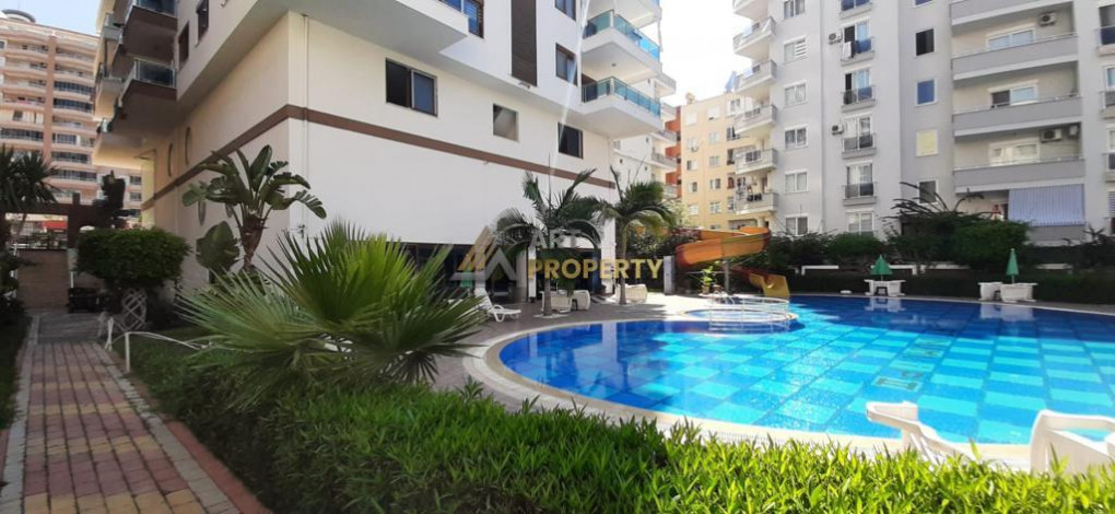 Меблированная квартира планировки 1+1, 65м2 в уютном комплексе района Махмутлар - Ракурс 14