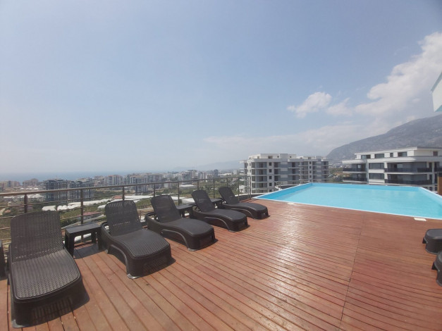 Меблированная квартира планировки 1+1, 65м2 в районе Махмутлар - Ракурс 10