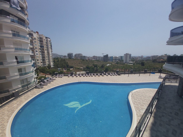 Меблированная квартира планировки 1+1, 65м2 в районе Махмутлар - Ракурс 12