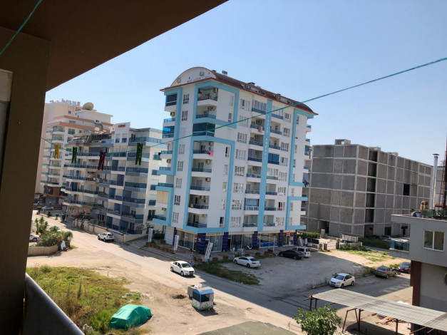 Двухкомнатная квартира с мебелью и техникой  в центре Махмутлара, 55 м2 - Ракурс 5