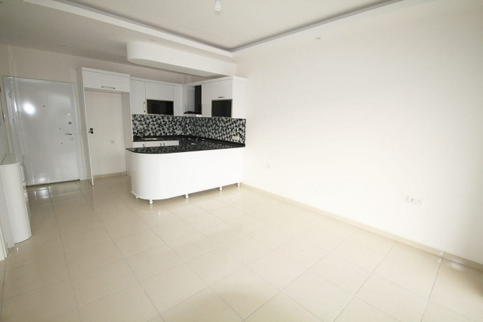 Просторная квартира планировки 1+1  с кухней американского типа, в Махмутларе, Алания, 60 м2. - Ракурс 3