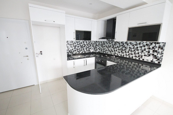 Просторная квартира планировки 1+1  с кухней американского типа, в Махмутларе, Алания, 60 м2. - Ракурс 18