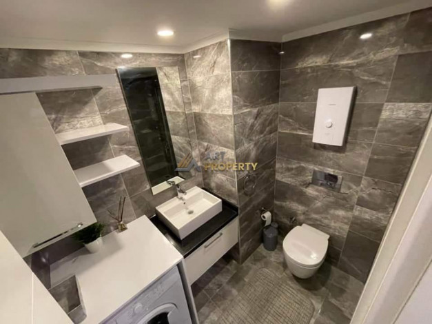 Меблированная квартира планировки 1+1, 65м2 в районе Махмутлар - Ракурс 18