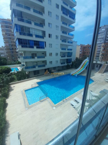 Меблированная квартира планировки 1+1, 70м2 в районе Махмутлар - Ракурс 9