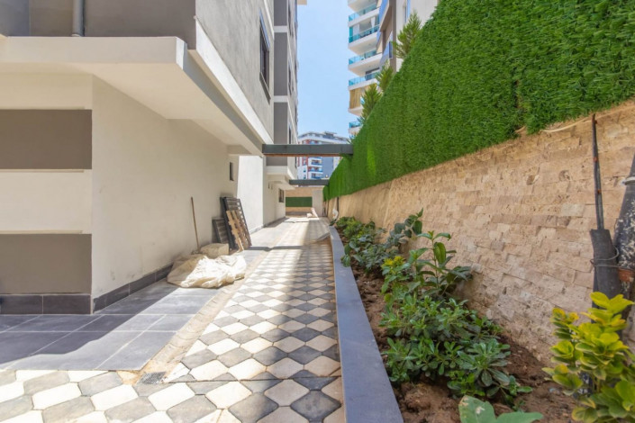 Меблированная квартира 1+1 в новом комплексе 2021 года в районе Махмутлар,  55 м2 - Ракурс 10