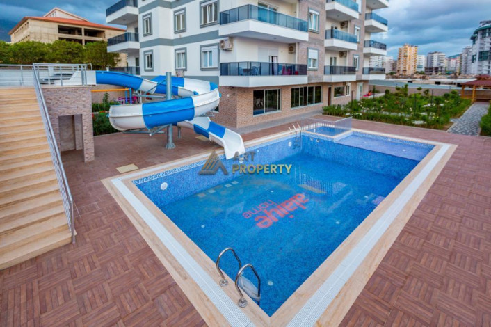 Квартира планировкой 1+1 с кухней американского типа, в районе Махмутлар, 70 м2. - Ракурс 9