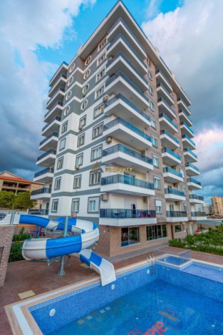 Квартира планировкой 1+1 с кухней американского типа, в районе Махмутлар, 70 м2. - Ракурс 10