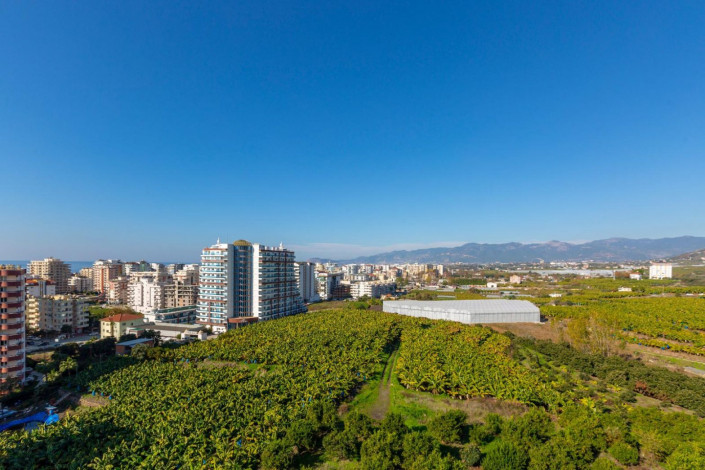 Квартира планировкой 1+1 с кухней американского типа, в районе Махмутлар, 70 м2. - Ракурс 11