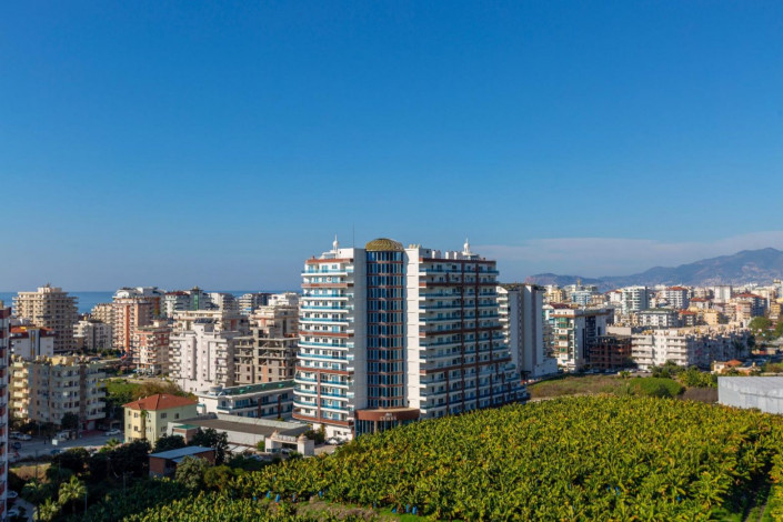 Квартира планировкой 1+1 с кухней американского типа, в районе Махмутлар, 70 м2. - Ракурс 12