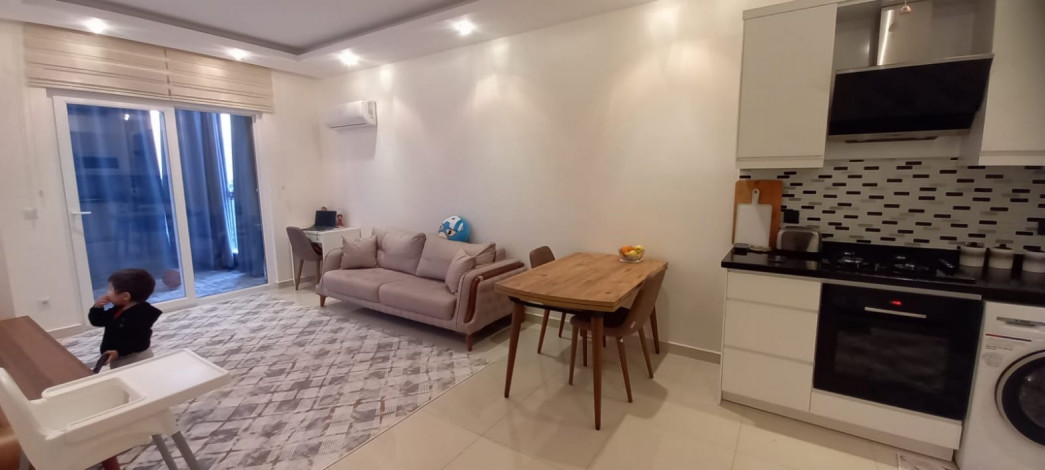 Квартира планировкой 1+1 с кухней американского типа, в районе Махмутлар, 70 м2. - Ракурс 13