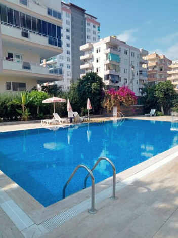 Меблированная квартира планировки 1+1, 60м2 в районе Махмутлар - Ракурс 5