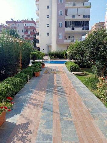 Меблированная квартира планировки 1+1, 60м2 в районе Махмутлар - Ракурс 11