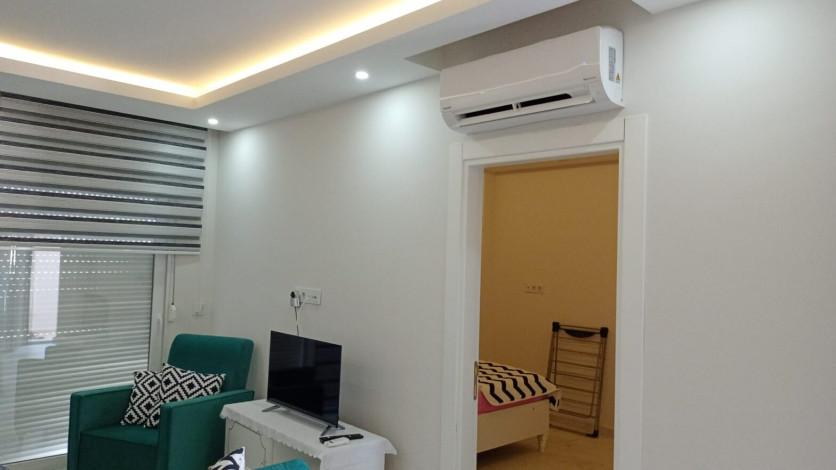 Меблированная квартира планировки 1+1, 60м2 в районе Махмутлар - Ракурс 2