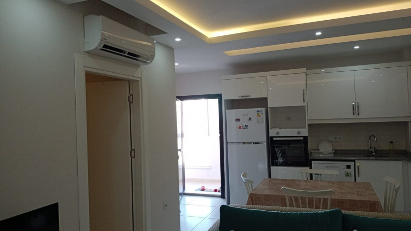 Меблированная квартира планировки 1+1, 60м2 в районе Махмутлар - Ракурс 8