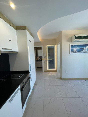 Меблированная квартира планировки 1+1, 55м2 в центре города Аланья - Ракурс 12