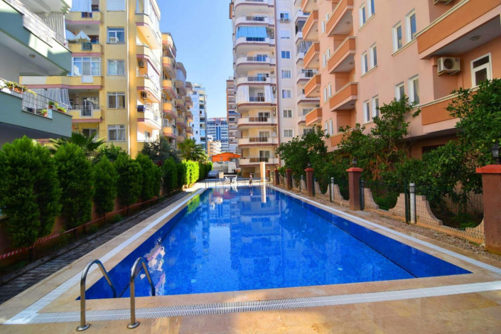 Двухкомнатная квартира в районе Махмутлар, Алания, рядом с вторничным  рынком, 65 м2. - Ракурс 25