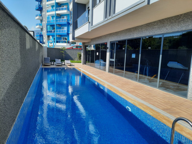 Меблированная квартира планировки 1+1, 55м2 в новом жилом комплексе, Махмутлар - Ракурс 9