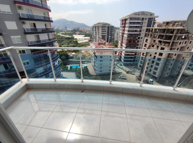 Уютная меблированная квартира планировки 1+1, 55м2 в районе Махмутлар - Ракурс 10