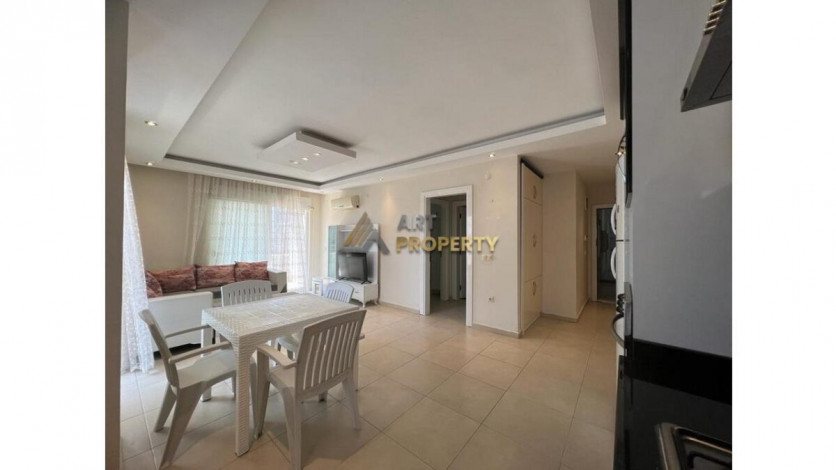 Просторная меблированная квартира планировки 1+1 в районе Махмутлар - Ракурс 4