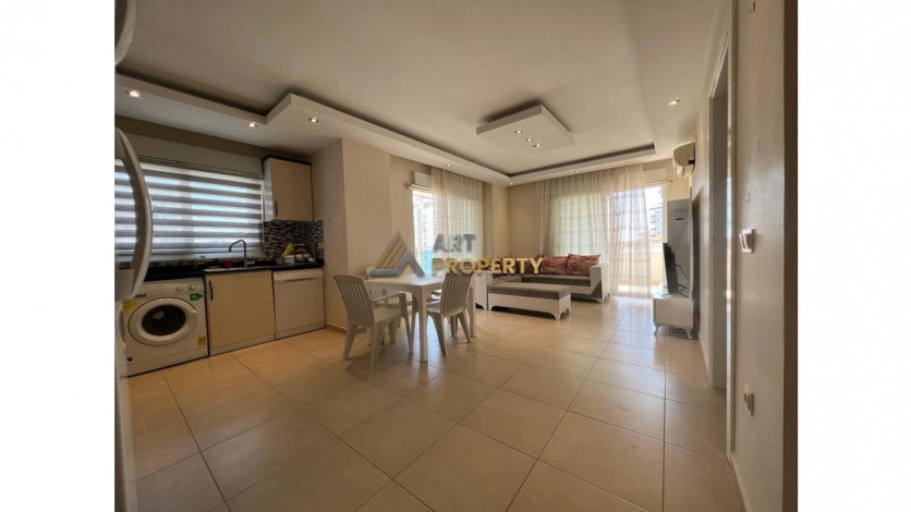 Просторная меблированная квартира планировки 1+1 в районе Махмутлар - Ракурс 9