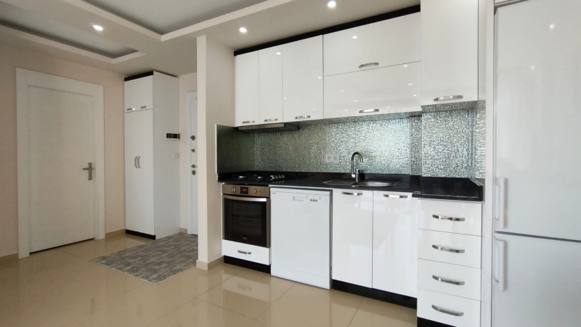 Меблированная квартира планировки 1+1, 60м2 в районе Махмутлар - Ракурс 6