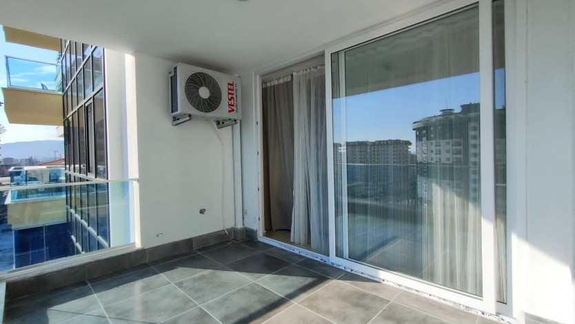 Меблированная квартира планировки 1+1, 60м2 в районе Махмутлар - Ракурс 15