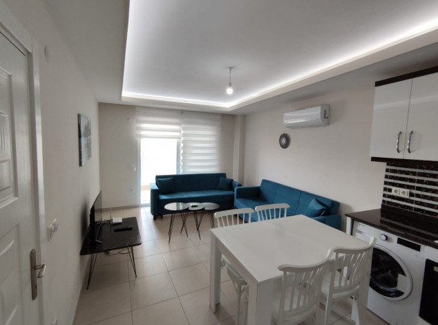 Меблированная квартира планировки 1+1, 60м2 в районе Махмутлар - Ракурс 8