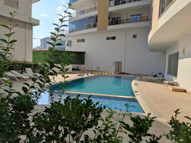 Меблированная квартира планировки 1+1, 60м2 в районе Махмутлар - Ракурс 14