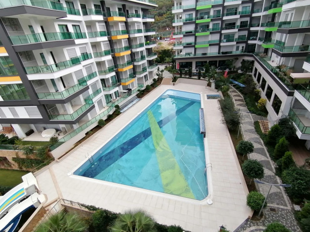 Двухкомнатная квартира с мебелью, в элитном комплексе, Каргыджак, Алания, 75 м2. - Ракурс 2