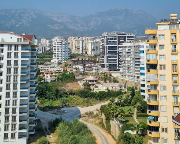 Меблированная квартира планировки 1+1, 55м2 в популярном ЖК, Махмутлар - Ракурс 12