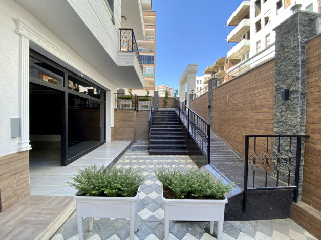 Новая двухкомнатная квартира в хорошем комплексе в Махмутлар,  55м2 - Ракурс 7