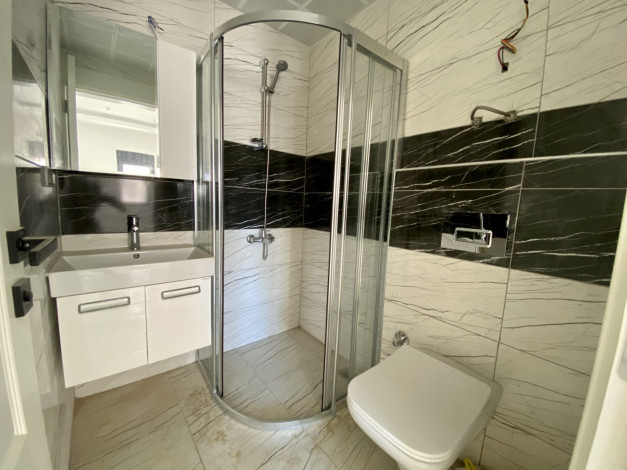 Новая двухкомнатная квартира в хорошем комплексе в Махмутлар,  55м2 - Ракурс 10