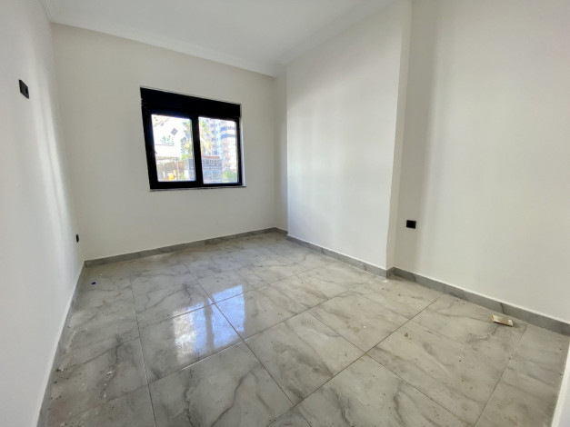 Новая двухкомнатная квартира в хорошем комплексе в Махмутлар,  55м2 - Ракурс 11