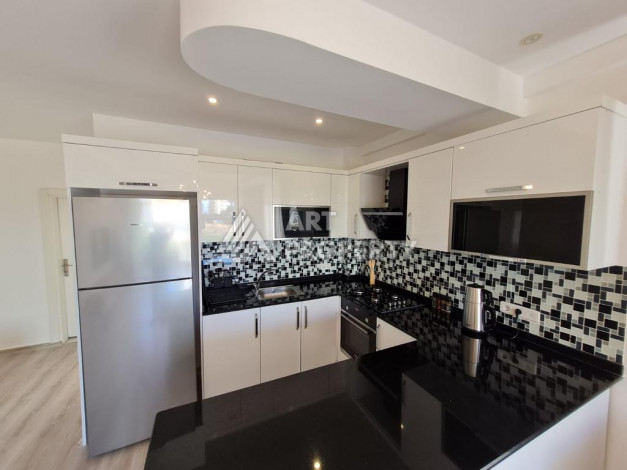 Меблированная квартира планировки 1+1 с большой площадью 70м2, район Махмутлар - Ракурс 3