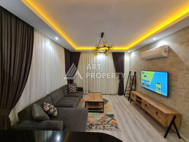 Меблированная квартира планировки 1+1 с большой площадью 70м2, район Махмутлар - Ракурс 4