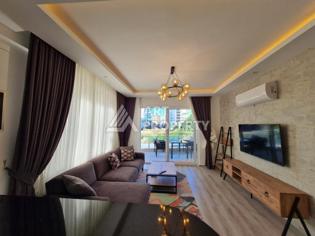 Меблированная квартира планировки 1+1 с большой площадью 70м2, район Махмутлар - Ракурс 5