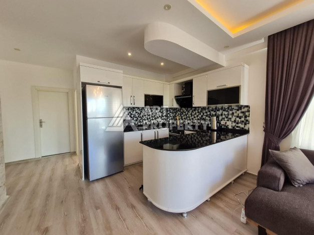 Меблированная квартира планировки 1+1 с большой площадью 70м2, район Махмутлар - Ракурс 6