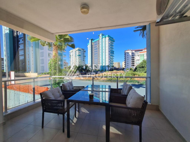 Меблированная квартира планировки 1+1 с большой площадью 70м2, район Махмутлар - Ракурс 9