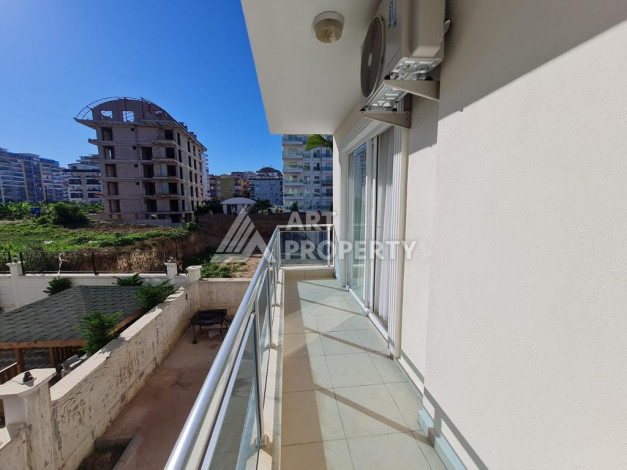 Меблированная квартира планировки 1+1 с большой площадью 70м2, район Махмутлар - Ракурс 10