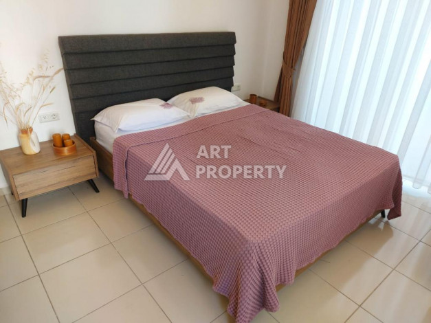 Меблированная квартира планировки 1+1 с большой площадью 70м2, район Махмутлар - Ракурс 12