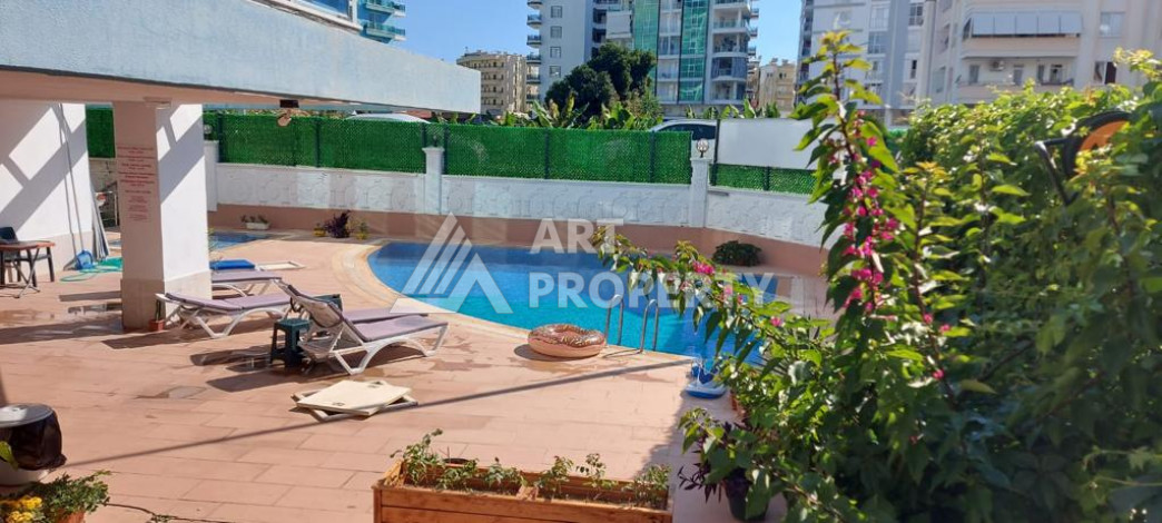 Меблированная квартира планировки 1+1 с большой площадью 70м2, район Махмутлар - Ракурс 13